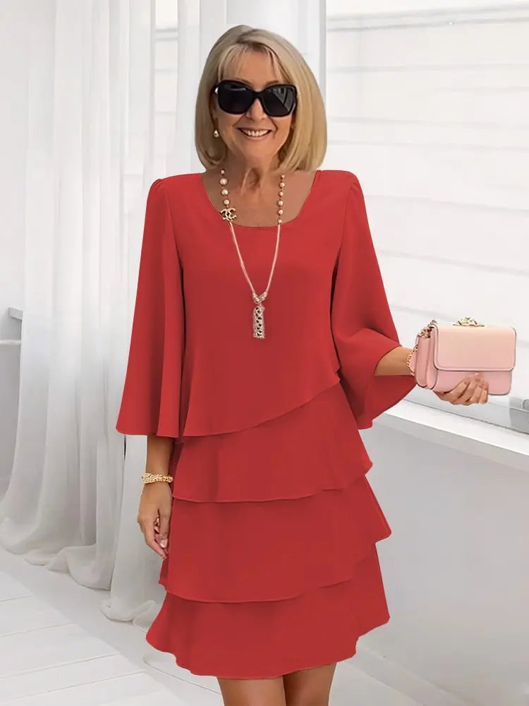 Elsa – Abito elegante e fluido con volant